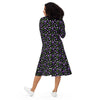 A person wearing a NerdyKeppie Raveyard Ghosts Genderqueer Pride Long Sleeve Midi Dress With Pockets. 