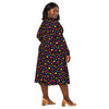 A person wearing a NerdyKeppie Raveyard Ghosts Pan Pride Long Sleeve Midi Dress With Pockets. 