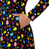 A person wearing a NerdyKeppie Raveyard Ghosts Progress Pride Long Sleeve Midi Dress With Pockets. 