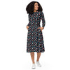 A person wearing a NerdyKeppie Raveyard Ghosts Trans Pride Long Sleeve Midi Dress With Pockets. 