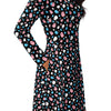 A person wearing a NerdyKeppie Raveyard Ghosts Trans Pride Long Sleeve Midi Dress With Pockets. 
