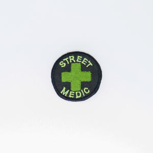 NerdyKeppie's Resistance Scouts "Street Medic" Embroidered Patch are stitched on black duck cloth and backed by sturdy vinyl fuse.