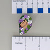NerdyKeppie Capybara Hearts Genderqueer Pride Enamel Pins. Our Capybara Hearts Genderqueer Pride Enamel Pins feature a cute capybara surrounded by flowers in Genderqueer Pride colors and ship from Portland, Oregon USA.