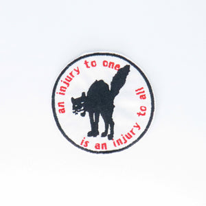 NerdyKeppie's Sabotabby "An Injury to One is an Injury to All" Embroidered Sabo-Tabby Patch are stitched on black duck cloth and backed by sturdy vinyl fuse.