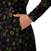 A person wearing a NerdyKeppie Scattered Dice Lesbian Pride Long Sleeve Midi Dress With Pockets. 