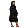 A person wearing a NerdyKeppie Scattered Dice Pan Pride Long Sleeve Midi Dress With Pockets. 