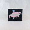 NerdyKeppie's Sea Turtle Embroidered Pride Patch are shaped like their namesake and stitched on black duck cloth!