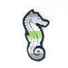 NerdyKeppie's Seahorse Embroidered Pride Patch are shaped like their namesake and stitched on black duck cloth!