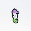 NerdyKeppie's Seahorse Embroidered Pride Patch are shaped like their namesake and stitched on black duck cloth!
