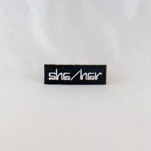 NerdyKeppie's She/Her Computerized Font Pronoun Embroidered Patch are stitched on sturdy rectangular duck cloth and backed with vinyl fuse.