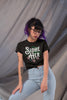 NerdyKeppie "Sidhe/Her" Floral Unisex Cotton Trans Pride Tee Shirt. 