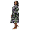 A person wearing a NerdyKeppie Splatter Wave Genderqueer Pride Long Sleeve Midi Dress With Pockets. 
