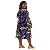 A person wearing a NerdyKeppie Splatter Wave Non-Binary Pride Long Sleeve Midi Dress With Pockets. 