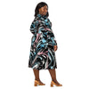 A person wearing a NerdyKeppie Splatter Wave Trans Pride Long Sleeve Midi Dress With Pockets. 