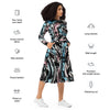 A person wearing a NerdyKeppie Splatter Wave Trans Pride Long Sleeve Midi Dress With Pockets. 