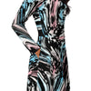 A person wearing a NerdyKeppie Splatter Wave Trans Pride Long Sleeve Midi Dress With Pockets. 