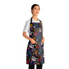 A person wearing a NerdyKeppie Stencil Roses Progress Pride Apron With Pocket. A black apron with a stencil roses design on it in progress pride colors. This gay pride pocket apron is made of durable 100% polyester.