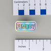 NerdyKeppie "FEMBOY" Mirrored Pride Pin. Mirrored pride pin with "FEMBOY" text, available in genderfluid, non-binary, rainbow, or transgender pride. Say it with your whole chest.