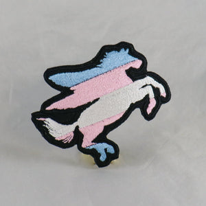 NerdyKeppie's Trans Pegasus Embroidered Pride Patch are shaped like their namesake and stitched on black duck cloth!
