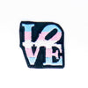 NerdyKeppie's Trans Philly LOVE Statue Embroidered Pride Patch are shaped like their namesake and stitched on black duck cloth!