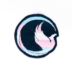 NerdyKeppie's Trans Phoenix Embroidered Pride Patch are shaped like their namesake and stitched on black duck cloth!