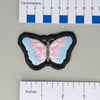 NerdyKeppie's Trans Psychedelic Butterfly Embroidered Pride Patch are shaped like their namesake and stitched on black duck cloth!