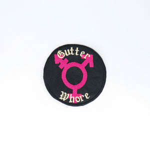 NerdyKeppie's Trans Symbol "Gutter Whore" Embroidered Patch are stitched on black duck cloth and backed by sturdy vinyl fuse.