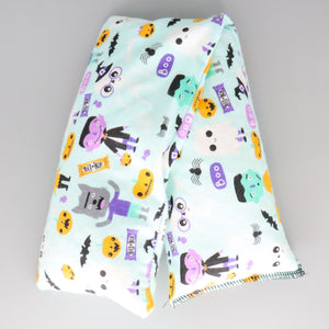 A NerdyKeppie Trick or Treat Cotton Flannel Heat & Cold Pack. A microwaveable heat and cold pack featuring a cute monster-themed design, great gift for friends with, you know, achy joints and stuff.