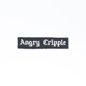 NerdyKeppie's White "Angry Cripple" Embroidered Disability Pride Patch are stitched on sturdy rectangular duck cloth and backed with vinyl fuse.