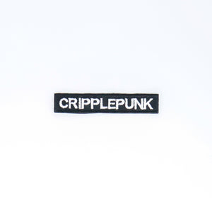 NerdyKeppie's White "Cripplepunk" Embroidered Disability Pride Patch are stitched on sturdy rectangular duck cloth and backed with vinyl fuse.