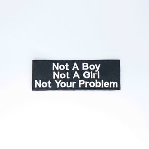 NerdyKeppie's White "Not A Boy Not A Girl Not Your Problem" Embroidered Patch are stitched on sturdy rectangular duck cloth and backed with vinyl fuse.