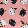 A NerdyKeppie Witchy Kitties on Pink Flannel Heat & Cold Pack. A microwaveable heat and cold pack featuring a kitty-themed design, great gift for friends with, you know, achy joints and stuff.