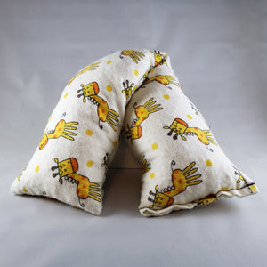 A NerdyKeppie Giraffe Flannel Heat & Cold Pack. 