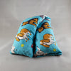 A NerdyKeppie Happy Dogs Flannel Heat & Cold Pack. 