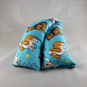A NerdyKeppie Happy Dogs Flannel Heat & Cold Pack. 