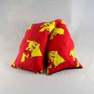 A NerdyKeppie Pikachu on Red Cotton Flannel Pokemon Heat & Cold Packs. 
